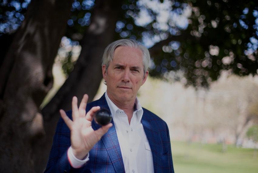 J. Clay Sell, CEO of X-energy, holds a billiards ball-sized model of a uranium "pebble," capable of fueling scalable nuclear reactors with reduced costs and heightened safety, in Austin on March 10, 2024.